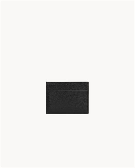 TINY CASSANDRE card case in grained leather .